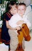 Emily and Luke on the rocking horse their grandfather made